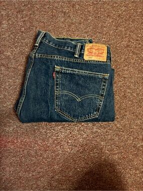 Levi's Men's Bootcut Dark Indigo Jeans with Tan Leather Patch